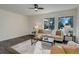 Inviting living room with hardwood floors, large windows, and comfortable seating arrangement at 3854 S Olathe Cir, Aurora, CO 80013