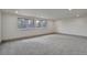 Spacious basement with neutral carpet and many windows at 12164 E Amherst Cir, Aurora, CO 80014