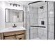 Contemporary bathroom featuring modern vanity, square mirror, and black fixtures at 12164 E Amherst Cir, Aurora, CO 80014