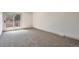 Neutral bedroom with carpet and a sliding glass door leading to backyard at 12164 E Amherst Cir, Aurora, CO 80014