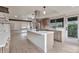 Well-lit kitchen with a large island, stainless steel appliances, and modern fixtures at 12164 E Amherst Cir, Aurora, CO 80014