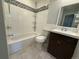 Updated bathroom with dark vanity and tiled shower/tub at 1811 S Quebec Way # 194, Denver, CO 80231