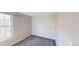 Second bedroom with patterned wall and carpet at 1811 S Quebec Way # 194, Denver, CO 80231