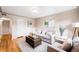 Cozy living room featuring hardwood floors, neutral decor, and comfortable seating arrangement at 2255 Perry St, Denver, CO 80212