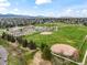 Scenic aerial view showcasing the school, park, and surrounding neighborhood at 10433 Red Mountain W, Littleton, CO 80127