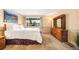 Bright and airy bedroom features neutral walls, large window, and ample natural light at 10433 Red Mountain W, Littleton, CO 80127