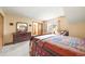 Comfortable bedroom featuring cozy decor, ample lighting, and a large window at 10433 Red Mountain W, Littleton, CO 80127