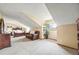 Large bonus room with sloped ceilings, carpeted floors, and ample space for living and relaxing at 10433 Red Mountain W, Littleton, CO 80127