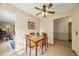 Charming dining room with wooden table and chairs, bathed in sunlight at 10433 Red Mountain W, Littleton, CO 80127