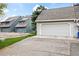 Attached two-car garage showcasing ample parking space and convenient access to the home at 10433 Red Mountain W, Littleton, CO 80127