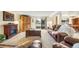 Relaxing living room features a fireplace, plush leather seating, and natural light at 10433 Red Mountain W, Littleton, CO 80127
