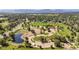 Picturesque park featuring green space, pond, parking, and recreational area at 735 Orchard Ct, Louisville, CO 80027