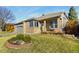 Inviting single-Gathering home with manicured lawn and a cozy front porch at 735 Orchard Ct, Louisville, CO 80027