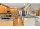 Well-equipped kitchen featuring granite countertops, wooden cabinets, and stainless steel appliances at 735 Orchard Ct, Louisville, CO 80027