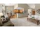 Open-concept living room featuring hardwood floors, recessed lighting, and a breakfast bar overlooking the kitchen at 735 Orchard Ct, Louisville, CO 80027