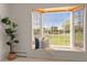 Bay window with a cozy seating area and bright natural light overlooking the yard at 2020 Routt St, Lakewood, CO 80215