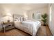 Bright bedroom featuring a queen size bed, white walls and plush carpet at 2020 Routt St, Lakewood, CO 80215