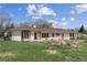 Charming single-story home boasts a well-maintained yard and a welcoming facade at 2020 Routt St, Lakewood, CO 80215