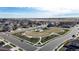 Aerial of the neighborhood park, surrounded by lovely houses, with a view of the open land beyond at 17947 E 95Th Ave, Commerce City, CO 80022