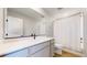 Well-lit bathroom with a white vanity, modern faucet, and large mirror at 17947 E 95Th Ave, Commerce City, CO 80022
