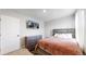 A bedroom with a bed, dresser, and TV at 17947 E 95Th Ave, Commerce City, CO 80022