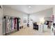 Bright bedroom featuring a vanity, storage, and a clothing rack by the window at 17947 E 95Th Ave, Commerce City, CO 80022