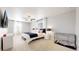 A bright bedroom with a ceiling fan, two windows, and a comfortable bed with white bedding at 17947 E 95Th Ave, Commerce City, CO 80022