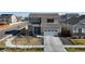 Two-story home with well-maintained landscaping and an attached garage at 17947 E 95Th Ave, Commerce City, CO 80022