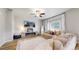Cozy living room with a ceiling fan, fireplace, and comfortable furnishings at 17947 E 95Th Ave, Commerce City, CO 80022