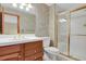 Bathroom featuring modern fixtures, a glass-enclosed shower and a large mirror for added light at 1972 Gold Camp Way, Franktown, CO 80116