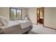 Cozy bedroom with large window, plush carpeting, comfortable seating and a serene view at 1972 Gold Camp Way, Franktown, CO 80116