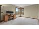 Office with large window, plush carpeting, natural wood desk, and serene view at 1972 Gold Camp Way, Franktown, CO 80116