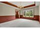Spacious dining room with a chandelier, wainscoting and a large window for natural light at 1972 Gold Camp Way, Franktown, CO 80116