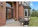 Inviting entryway with a wrought iron door and cozy seating area at 1972 Gold Camp Way, Franktown, CO 80116