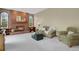 Cozy living room featuring a brick fireplace and comfortable seating at 1972 Gold Camp Way, Franktown, CO 80116