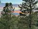 Picturesque sunset view over the mountains, seen through the trees at 1972 Gold Camp Way, Franktown, CO 80116