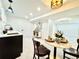 Basement bar and entertainment area with modern finishes and recessed lighting at 5563 E Jefferson Ave, Denver, CO 80237