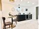 Basement featuring a wet bar, a dining area, and stylish decor at 5563 E Jefferson Ave, Denver, CO 80237