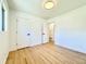 Clean bedroom featuring hardwood floors and white walls at 5563 E Jefferson Ave, Denver, CO 80237