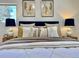Bedroom showcasing a neatly made bed with decorative pillows and bedside lamps for a cozy feel at 5563 E Jefferson Ave, Denver, CO 80237