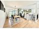 Open dining room with adjacent kitchen featuring sleek appliances and ample natural light at 5563 E Jefferson Ave, Denver, CO 80237