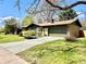 Well maintained ranch home with a spacious driveway, garage, and lovely landscaping at 5563 E Jefferson Ave, Denver, CO 80237