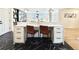Stylish kitchen island with white countertops, woven chairs, black marble floors, and contemporary pendant lighting at 5563 E Jefferson Ave, Denver, CO 80237