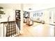 Expansive view of the open-concept living room with stairs, fireplace and large windows at 5563 E Jefferson Ave, Denver, CO 80237