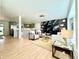 Bright open-concept living room featuring a fireplace and modern decor at 5563 E Jefferson Ave, Denver, CO 80237