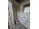 Small bathroom featuring a toilet, sink, and mirrored wall at 1717 Oswego St, Aurora, CO 80010