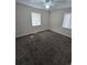 A spacious bedroom featuring neutral carpet and two windows offering ample natural light at 1717 Oswego St, Aurora, CO 80010