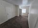 Standard bedroom featuring neutral carpeting, a window, and closet doors at 1717 Oswego St, Aurora, CO 80010
