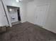 Carpeted room with a bathroom nook featuring a sink and a stall shower at 1717 Oswego St, Aurora, CO 80010