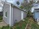 Gray siding on a home with white trim and a small yard with green vegetation and a chain link fence at 1717 Oswego St, Aurora, CO 80010